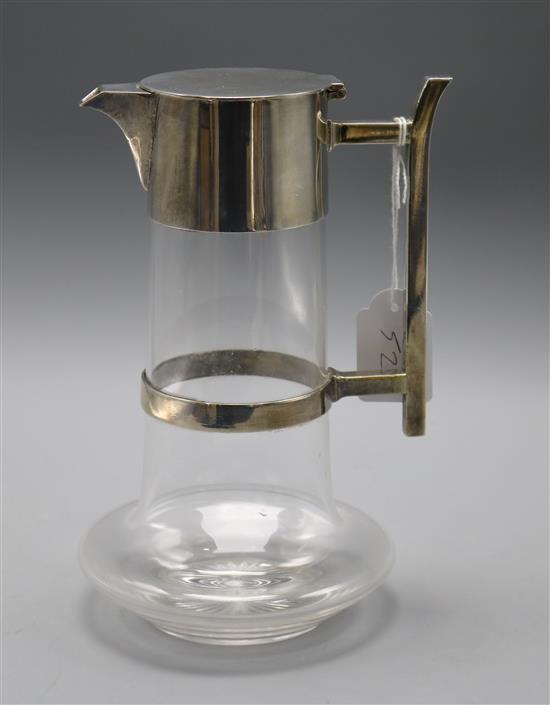 A Hukin and Heath silver plate mounted glass claret jug in the manner of Christopher Dresser, 22.4cm.